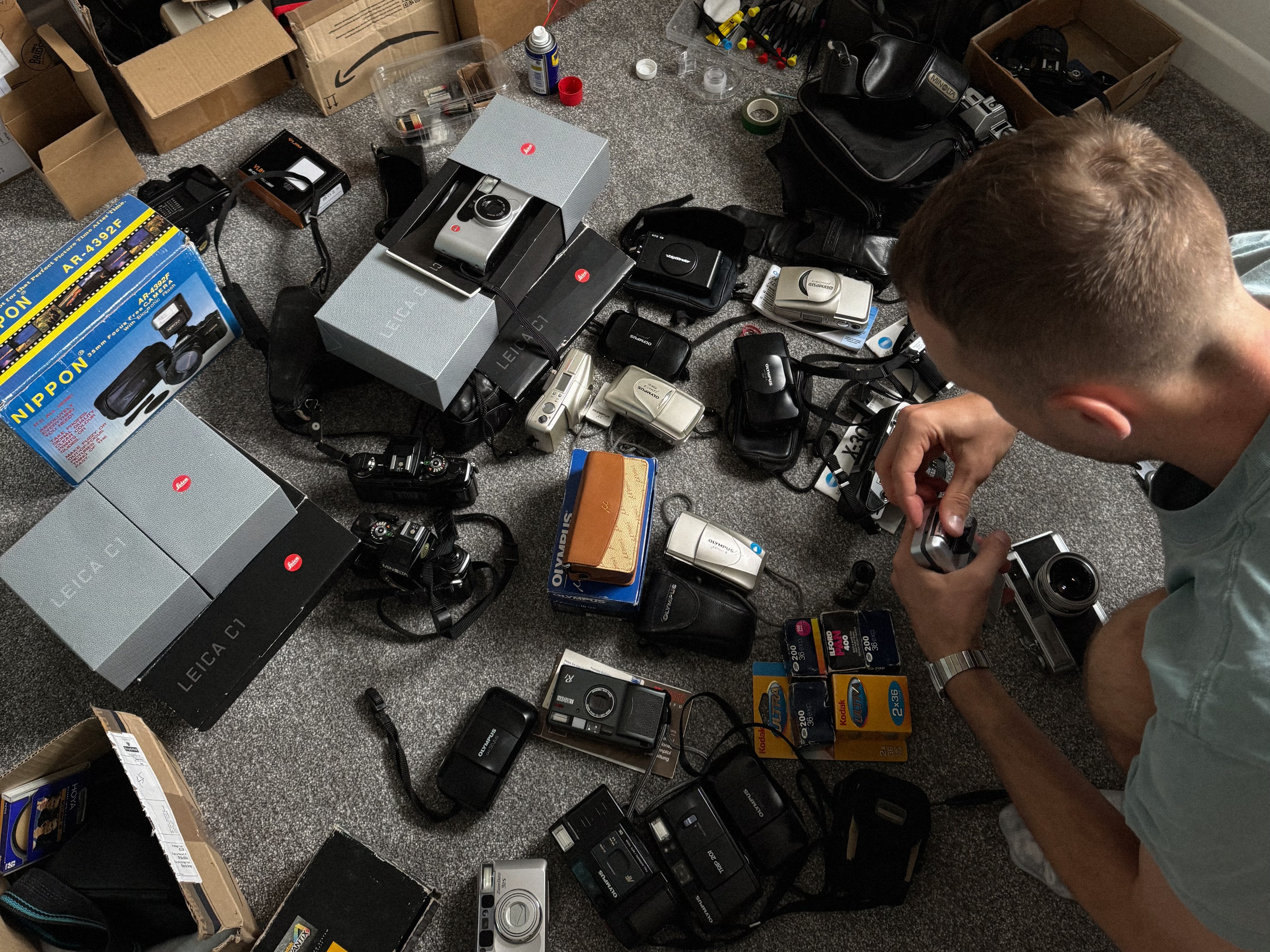 Sergei servicing part of his collection of vintage film cameras